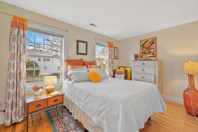 bedroom with light hardwood / wood-style floors