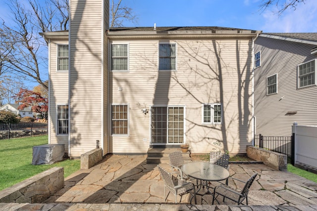 rear view of house with a patio