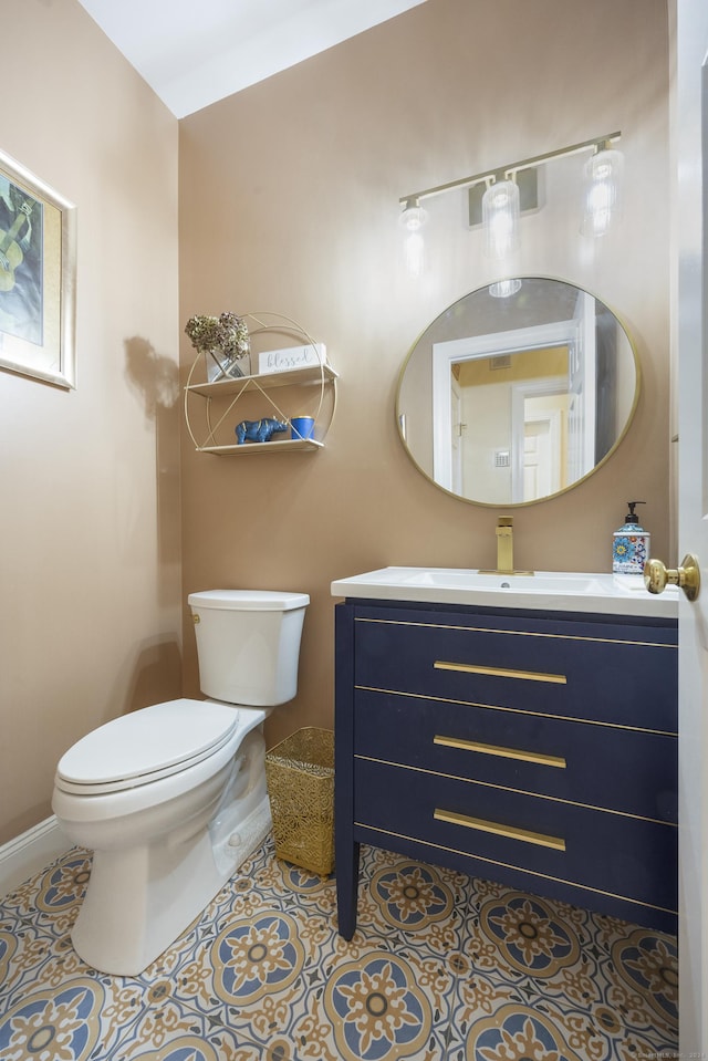 bathroom with tile patterned floors, vanity, and toilet