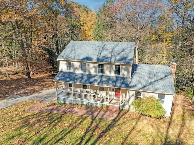 view of front of house with a front lawn and a porch