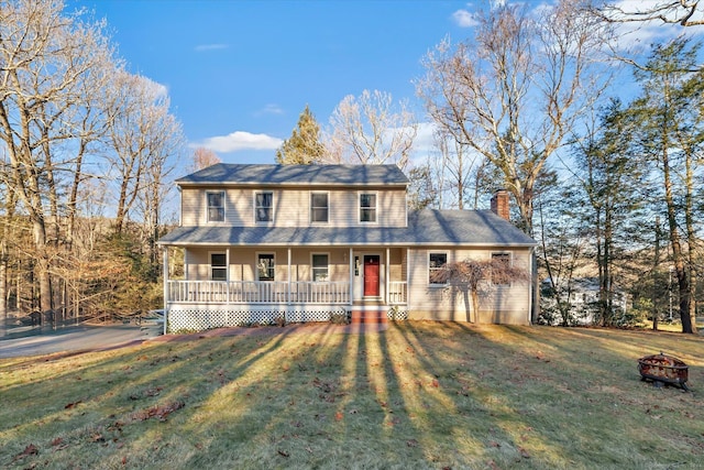 view of front of house featuring a front yard and covered porch