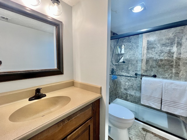 bathroom with vanity, toilet, and walk in shower