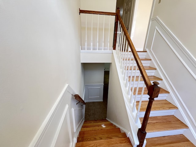 stairs with hardwood / wood-style flooring