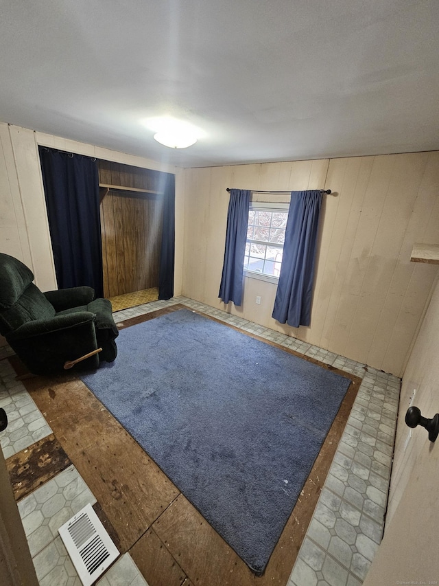 sitting room with wood walls