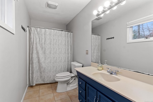 bathroom featuring tile patterned flooring, vanity, and toilet