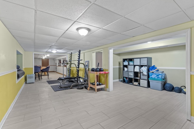 exercise room with a drop ceiling