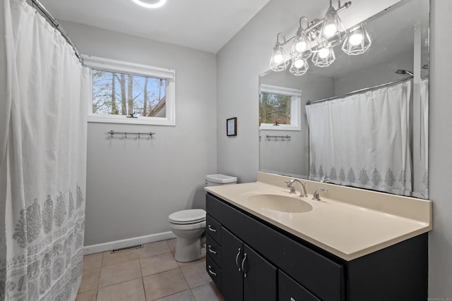 bathroom featuring tile patterned floors, vanity, and toilet