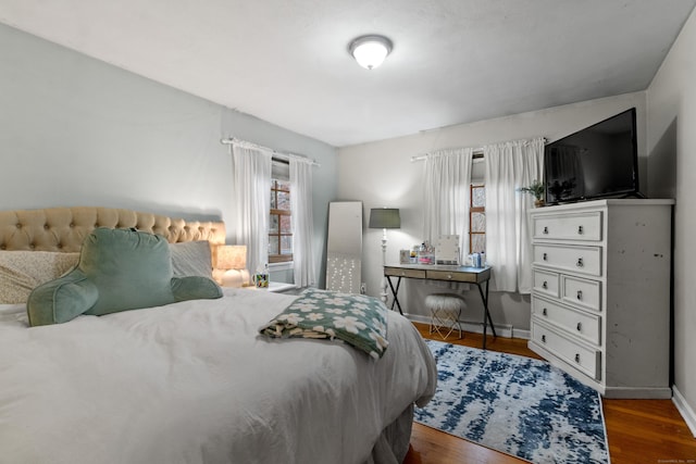 bedroom featuring dark wood-type flooring