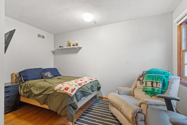 bedroom featuring wood-type flooring