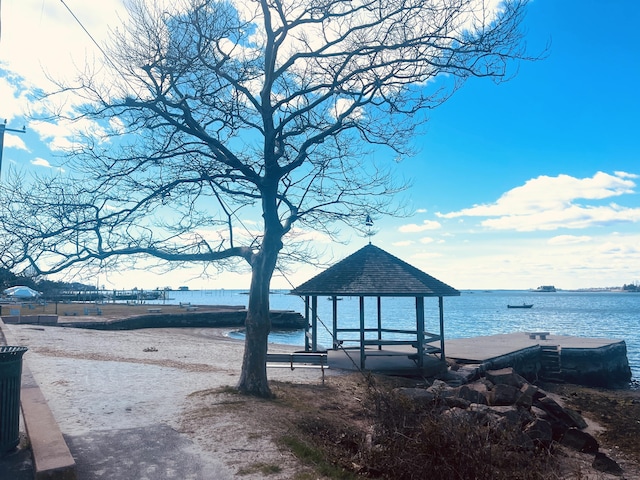 exterior space with a gazebo and a water view