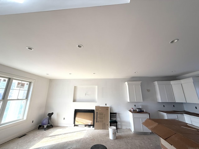 kitchen featuring white cabinets