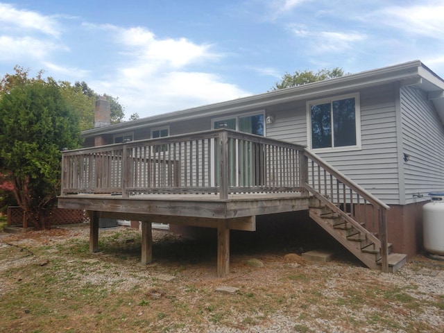 back of property featuring a deck