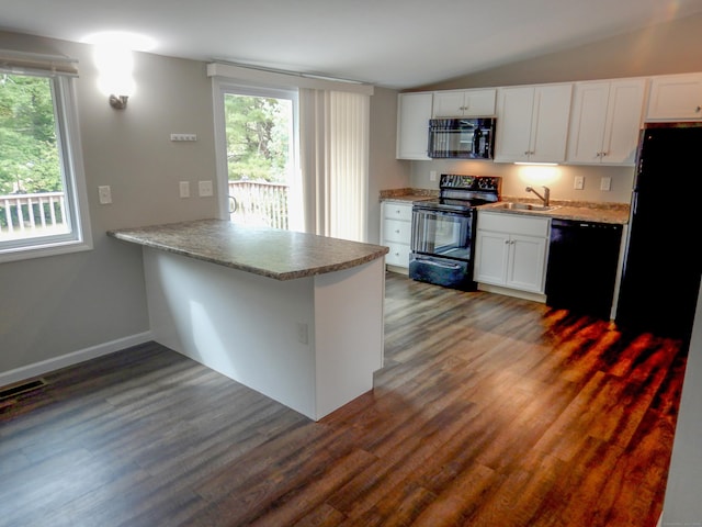 kitchen featuring kitchen peninsula, dark hardwood / wood-style flooring, black appliances, white cabinetry, and lofted ceiling