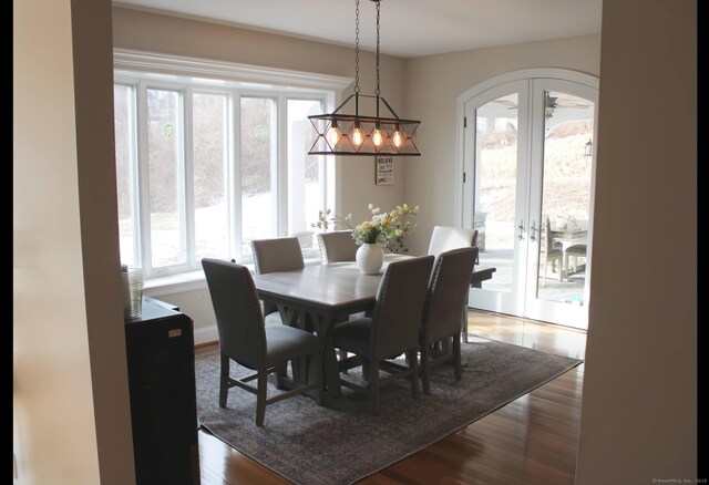 1461 Bunker Hill Rd, Watertown, CT 06795 - dining room featuring arched walkways and wood finished floors