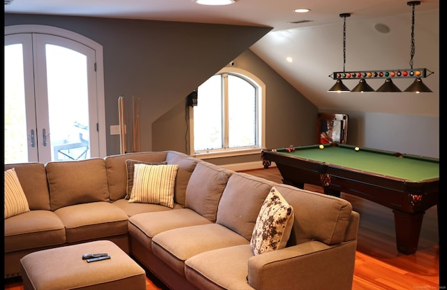 rec room with french doors, billiards, wood-type flooring, and vaulted ceiling