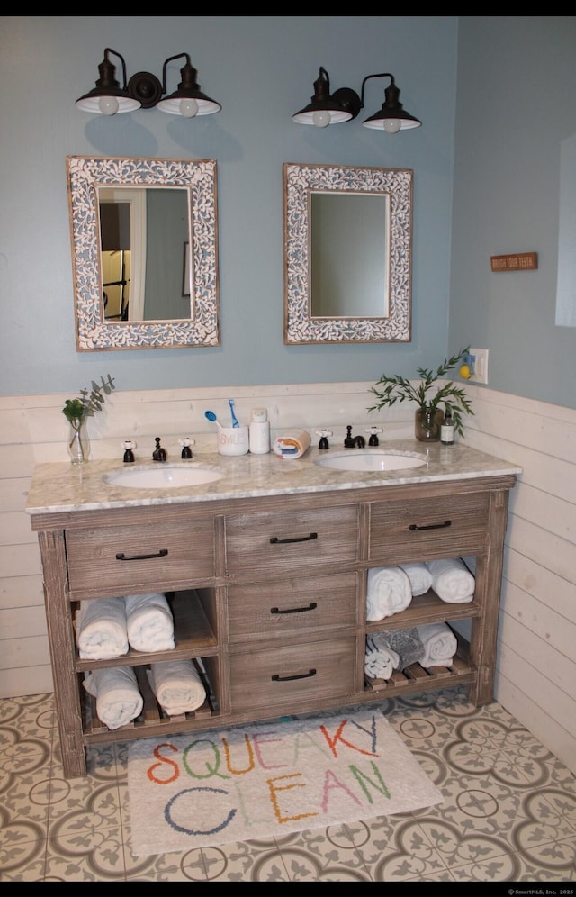 1461 Bunker Hill Rd, Watertown, CT 06795 - full bath featuring a wainscoted wall, wooden walls, double vanity, and a sink