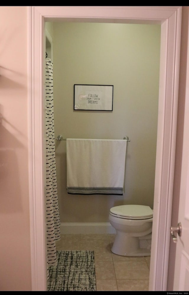 1461 Bunker Hill Rd, Watertown, CT 06795 - full bathroom with tile patterned floors, baseboards, a shower with shower curtain, and toilet