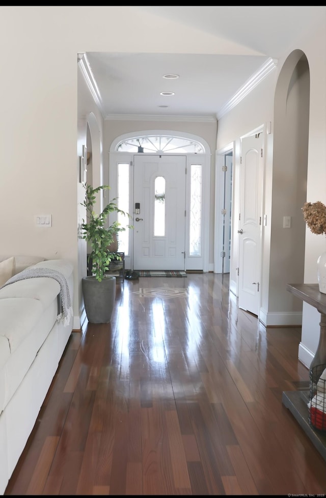 1461 Bunker Hill Rd, Watertown, CT 06795 - foyer featuring ornamental molding, arched walkways, wood finished floors, and baseboards
