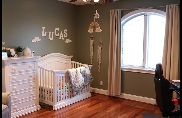 1461 Bunker Hill Rd, Watertown, CT 06795 - bedroom featuring multiple windows, wood finished floors, and a crib
