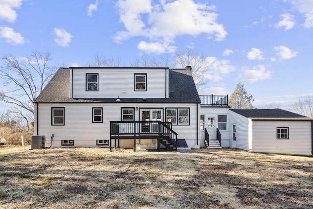 rear view of property featuring central AC unit