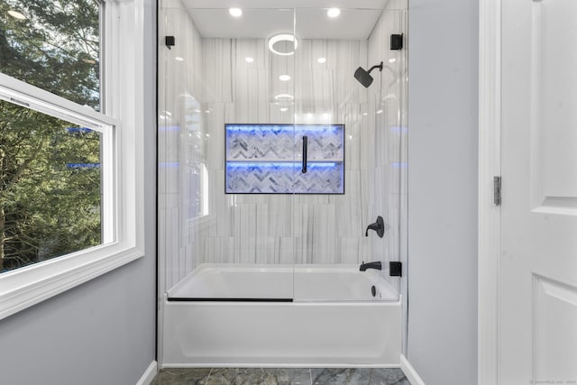 bathroom with enclosed tub / shower combo