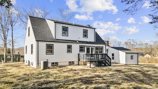 back of house with a yard, central AC, an outdoor structure, and a wooden deck