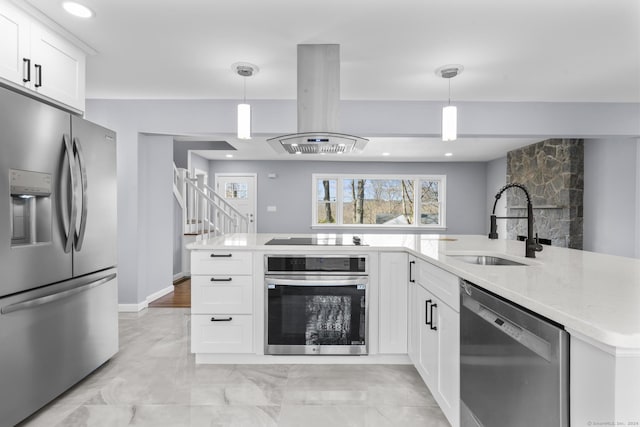 kitchen with white cabinetry, stainless steel appliances, and hanging light fixtures