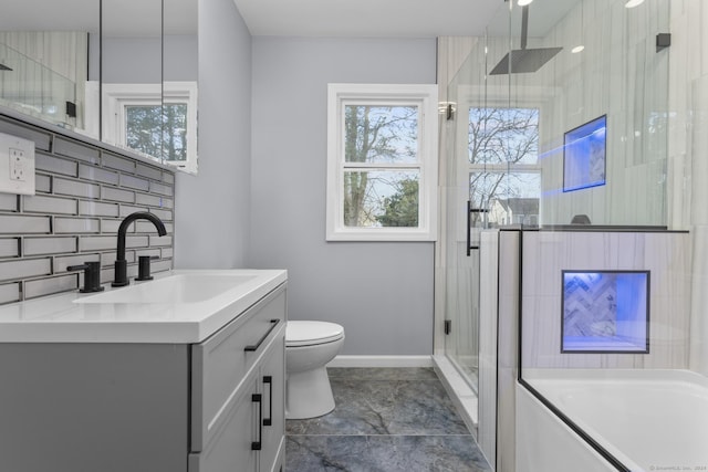 full bathroom with vanity, separate shower and tub, toilet, and tasteful backsplash