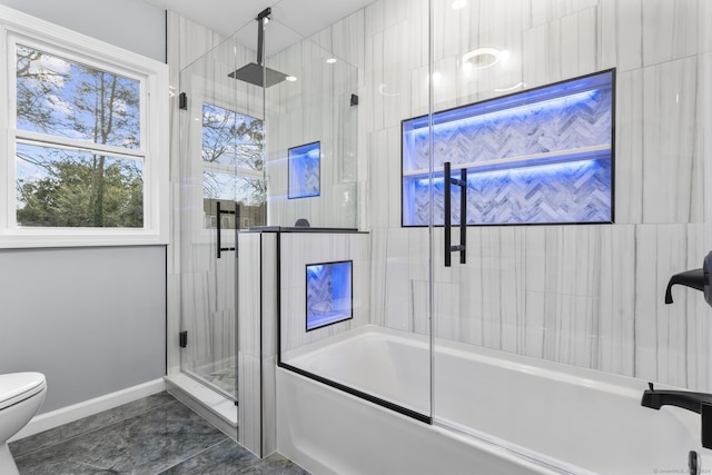 bathroom with shower / bath combination with glass door and toilet