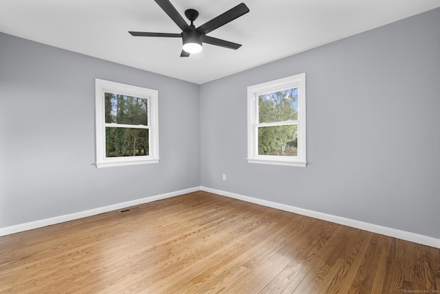 empty room featuring light hardwood / wood-style floors and ceiling fan