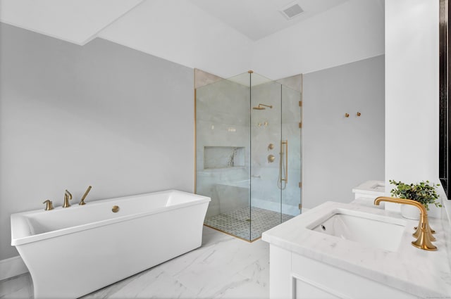 bathroom with vanity and independent shower and bath