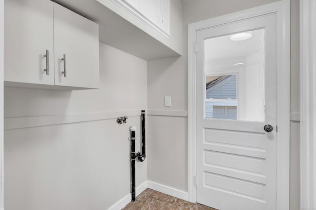 washroom featuring cabinets