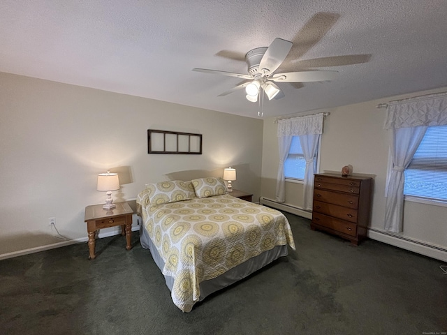 bedroom featuring dark carpet, ceiling fan, and a baseboard heating unit