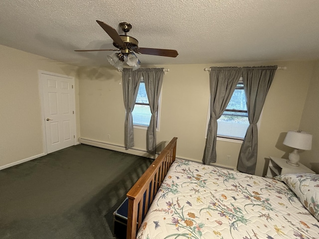 unfurnished bedroom with multiple windows, carpet, a textured ceiling, and ceiling fan