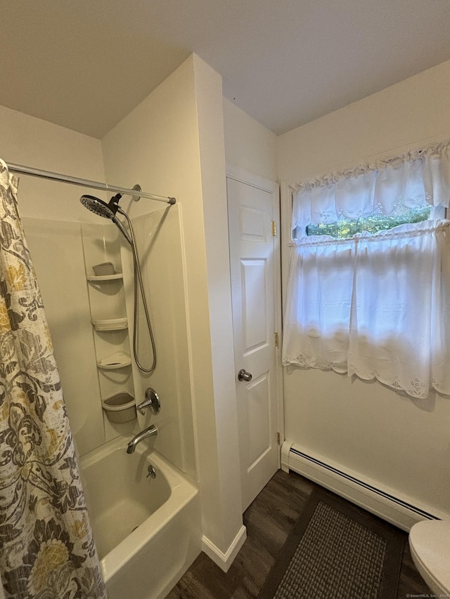 bathroom with wood-type flooring, a baseboard radiator, and shower / bath combo with shower curtain