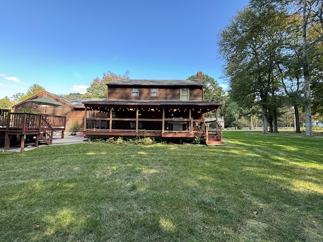 rear view of house with a lawn