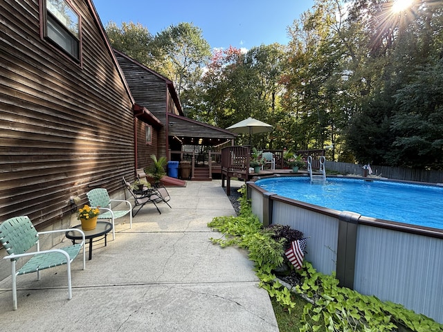 view of pool featuring a wooden deck