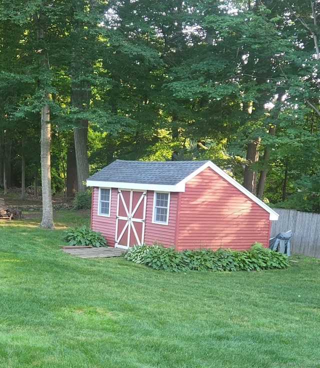 view of outdoor structure with a lawn