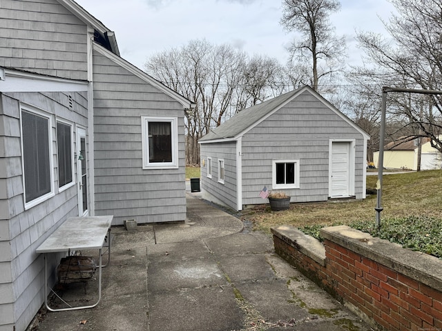 view of patio / terrace featuring an outbuilding