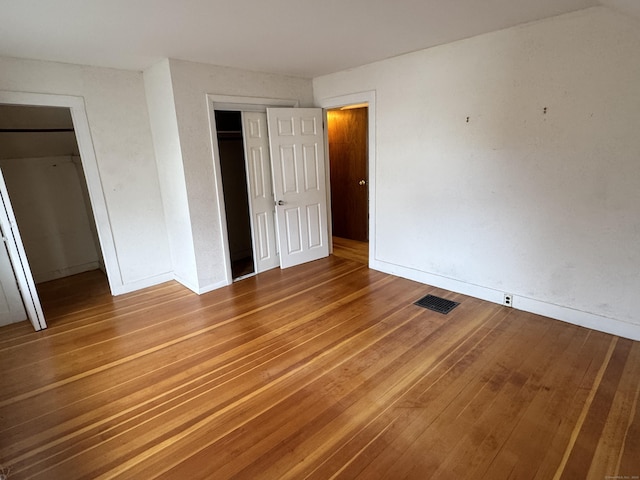 unfurnished bedroom featuring wood-type flooring