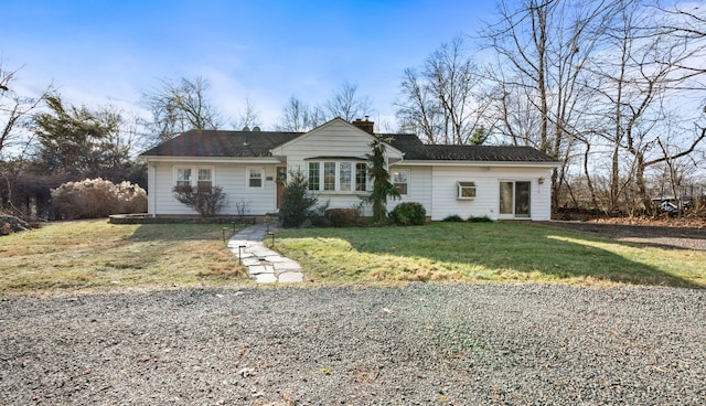 ranch-style home with a front yard