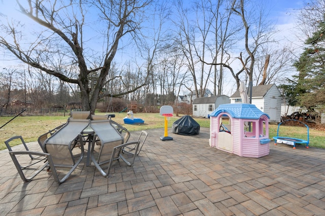 view of patio / terrace featuring an outbuilding