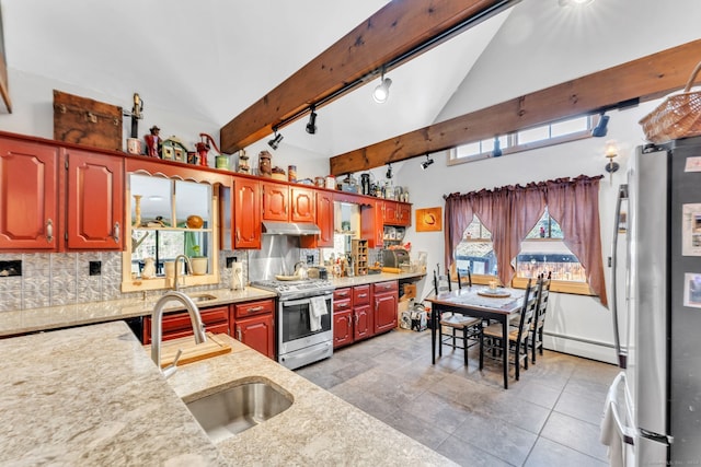 kitchen with beam ceiling, decorative backsplash, sink, and appliances with stainless steel finishes