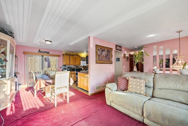 carpeted living room with a textured ceiling