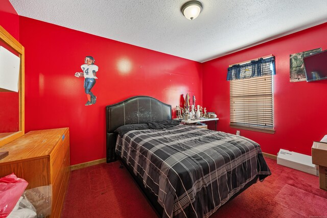 carpeted bedroom with a textured ceiling