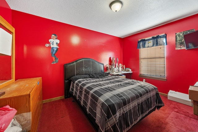 carpeted bedroom with baseboards and a textured ceiling
