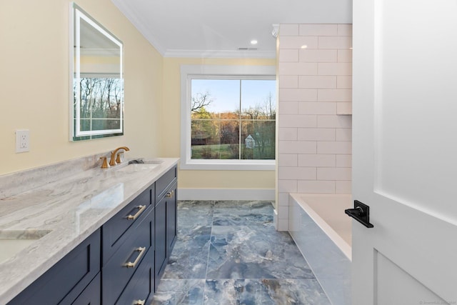 bathroom with a washtub, vanity, a wealth of natural light, and crown molding