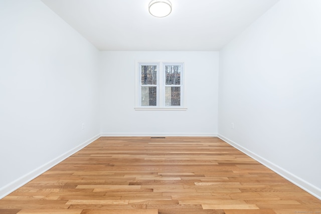 spare room featuring light hardwood / wood-style flooring