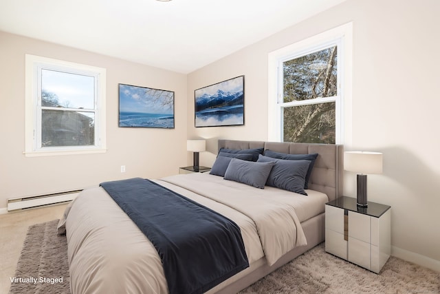 carpeted bedroom with a baseboard radiator