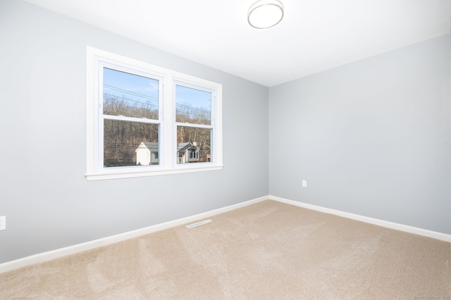 spare room with carpet flooring